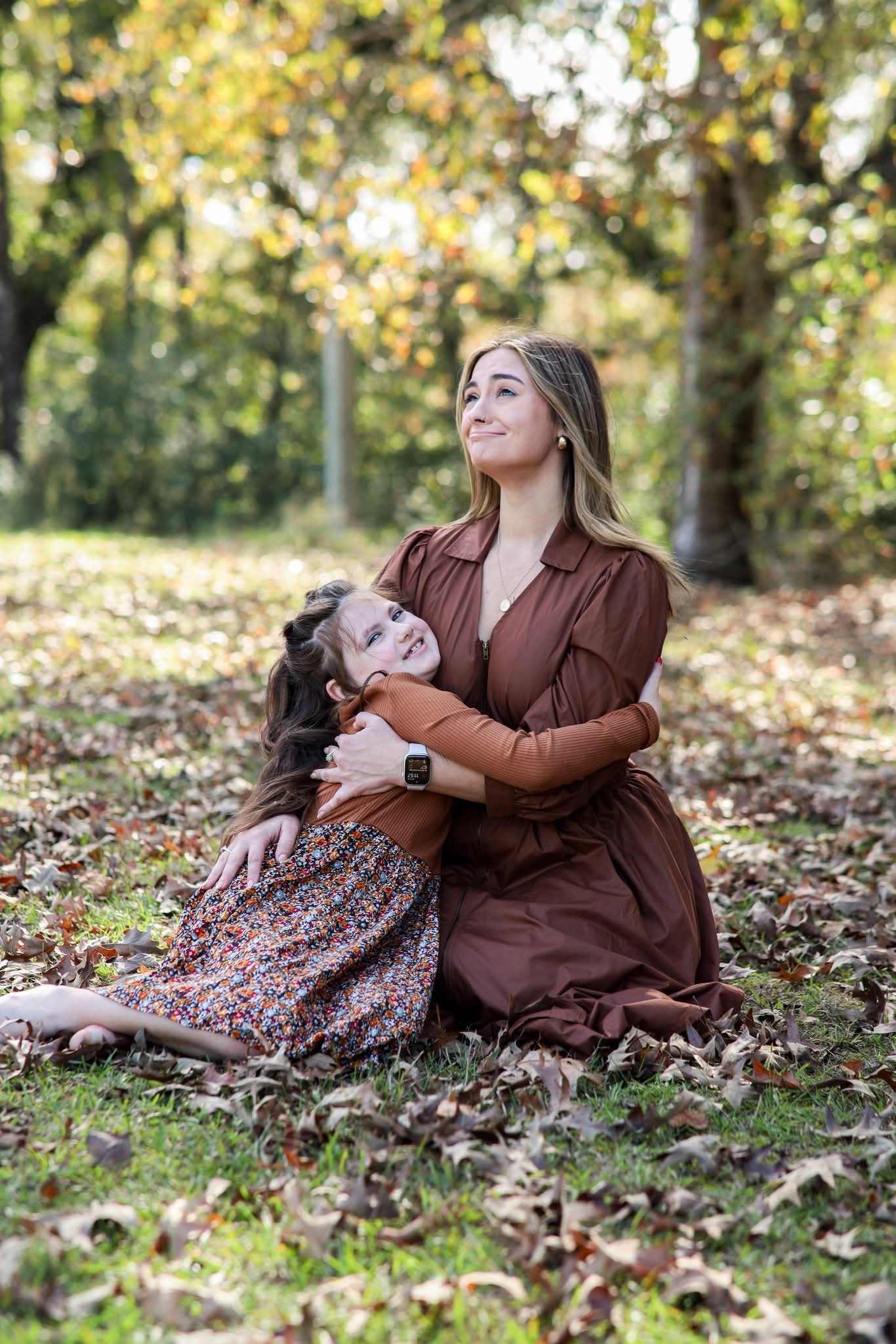 Kristi with her daughter outdoors